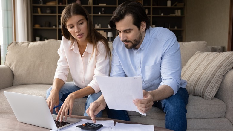 couple paying rent