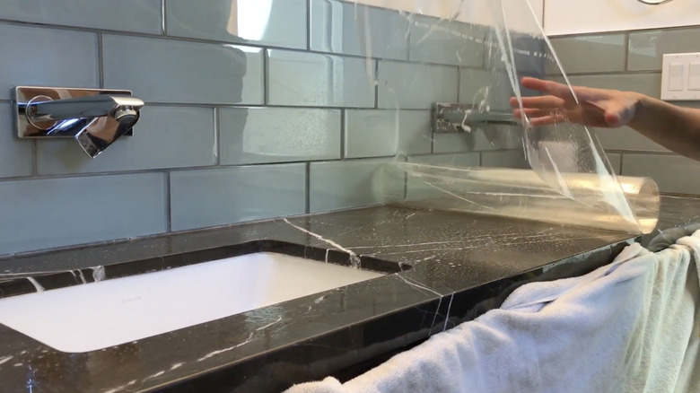 installing PPF to protect countertop