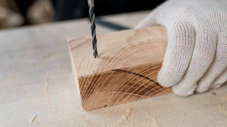 drilling hole into wood block 