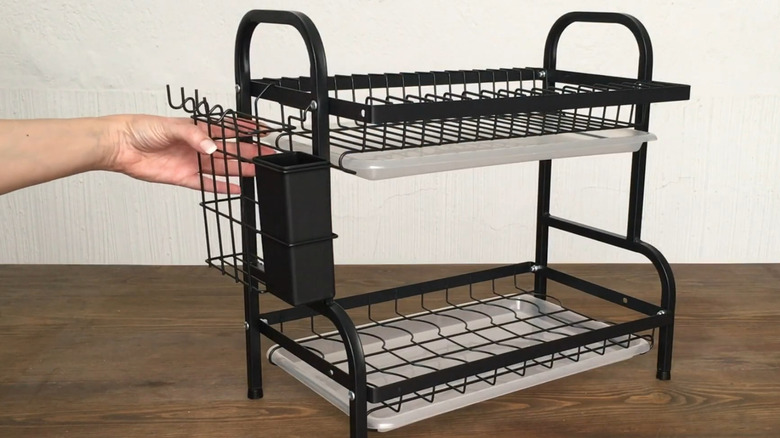 hand holding dish rack