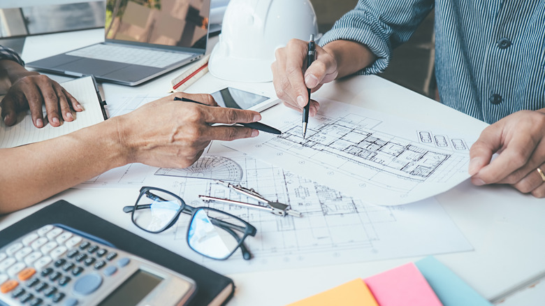 group reviewing building plans