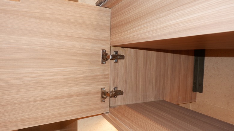 A cabinet is installed with soft close hinges