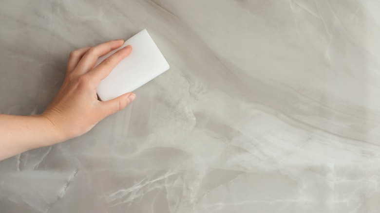 wiping quartz with a melamine sponge