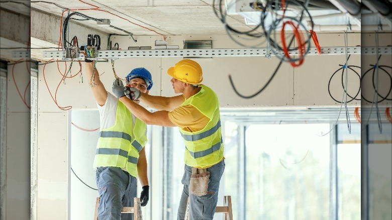 electricians working on wiring