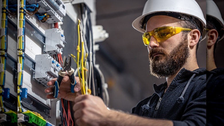 electrician work on panel