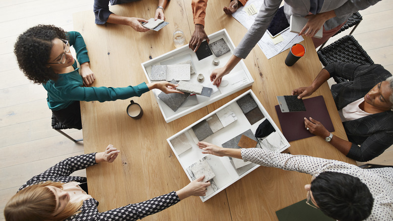 A group of people looking at different backsplash options