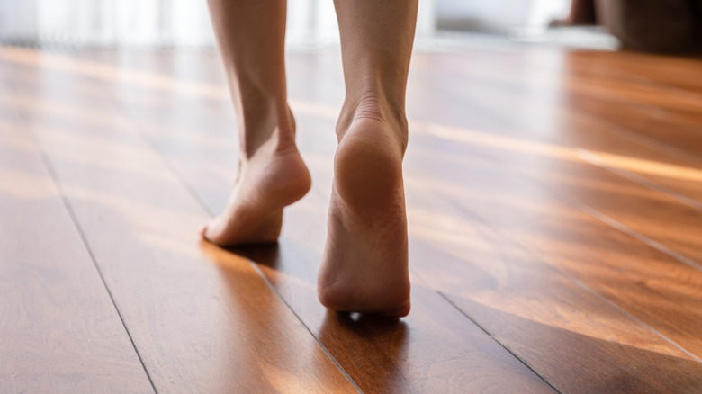 bare feet on hardwood floor