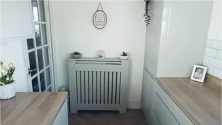 Gray radiator cover with plants