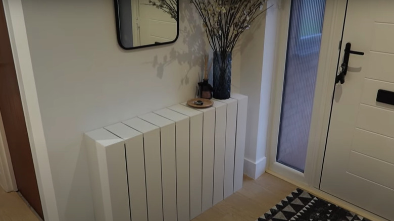 White shiplap cover over radiator