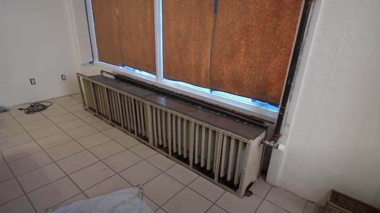 Large radiator underneath windows