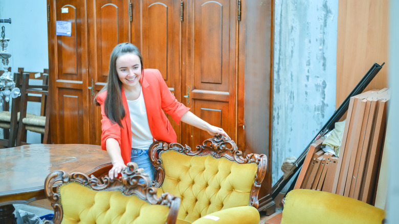 Woman shopping for second-hand furniture