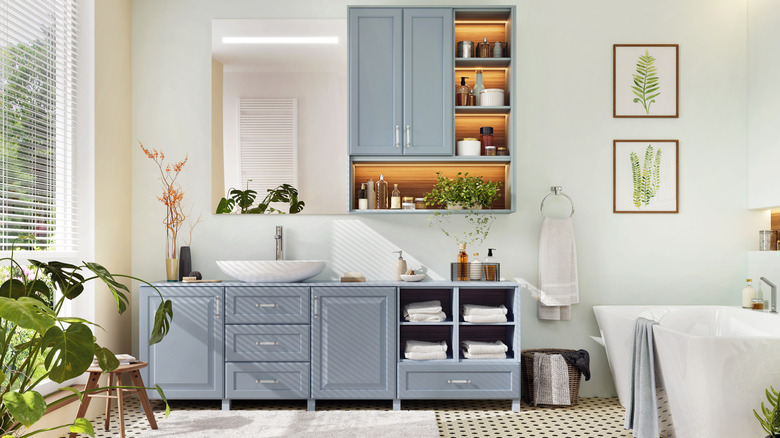 Bathroom with wood cabinet vanity and wall storage