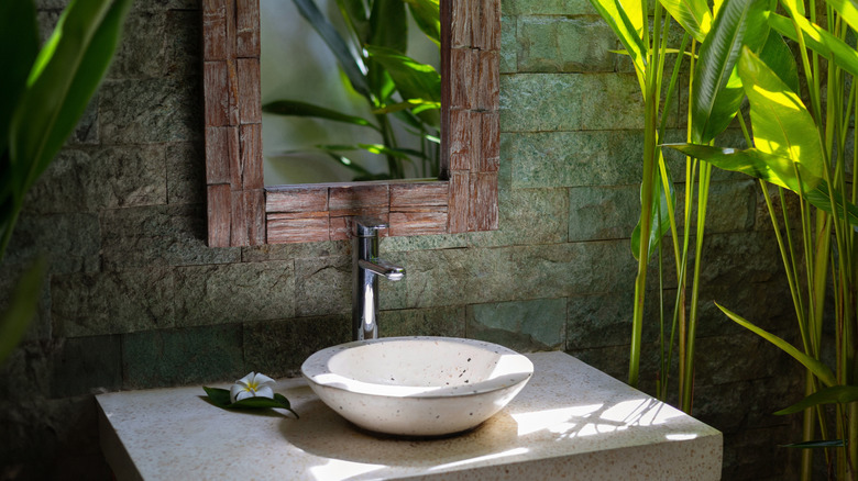 Outdoor vessel sink with mirror and faucet