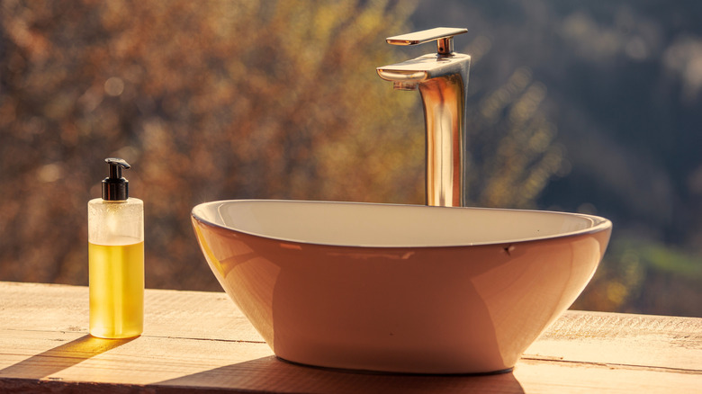 A minimal, fashionable outdoor sink sits in morning light