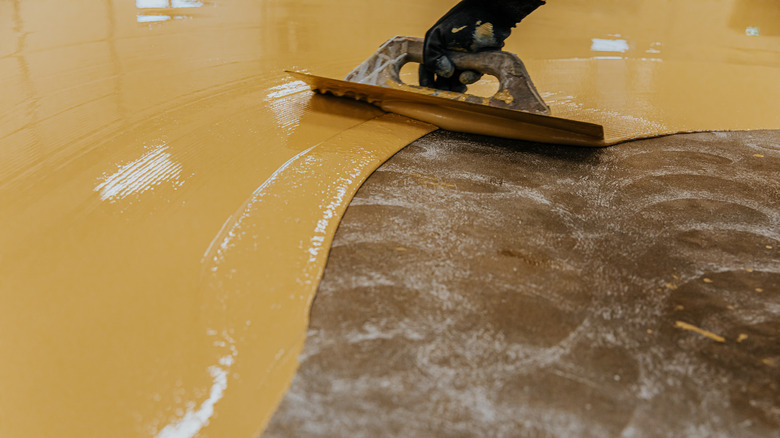 applying epoxy to a floor