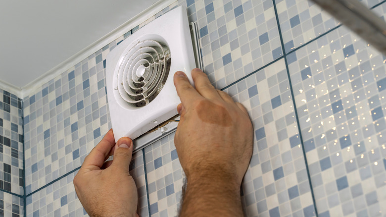 Removing an exhaust fan grate