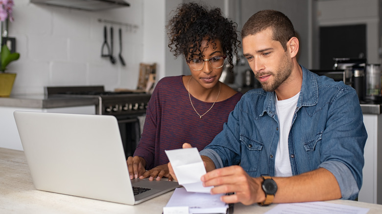 Couple checking bills