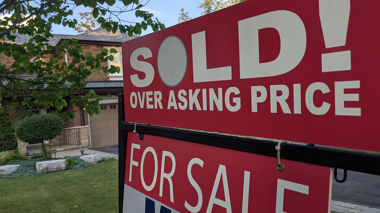 sold sign in front of house