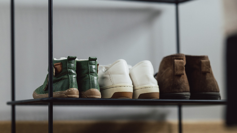 Shoes on black shelf 