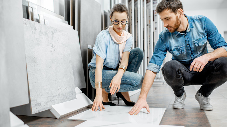 A couple choosing tile