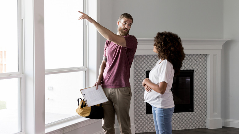 inspector talking to woman