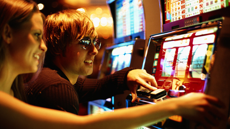 Woman playing on slot machines 