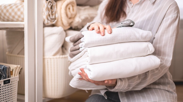 Woman holding linens