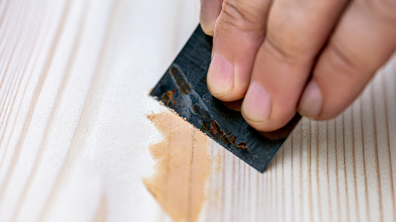 hand scraping filler on wood