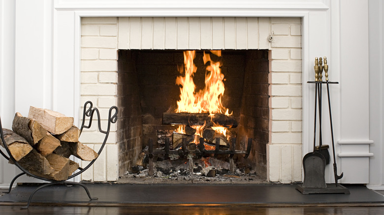 A fireplace with wood burning