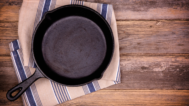 Cast iron pan wooden backdrop