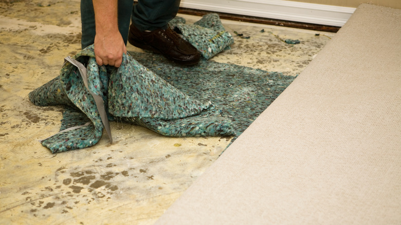 Removing carpet to expose subfloor