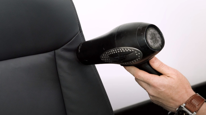 Blow-drying a leather chair