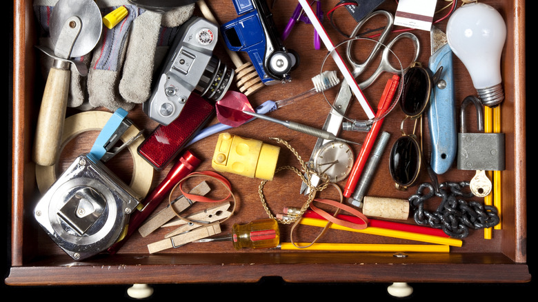 Messy drawer full of random items