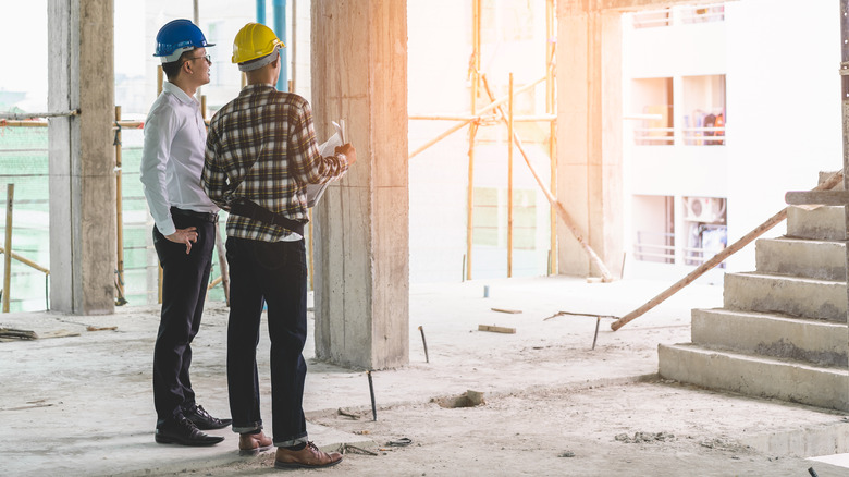 construction workers in unfinished building