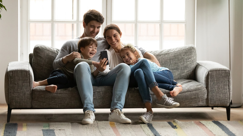 family of four on couch