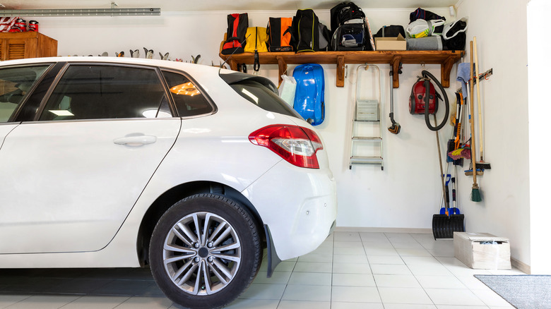 organized garage with tools and car