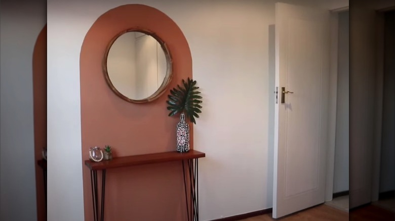 painted arch with mirror