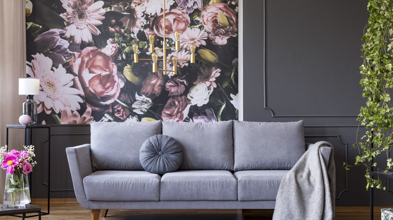 pink flower wallpaper behind couch