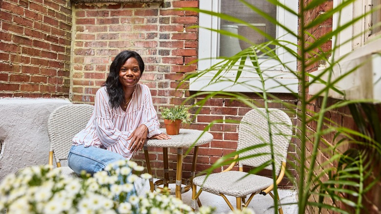 Keyanna Bowen smiling at a patio set outside