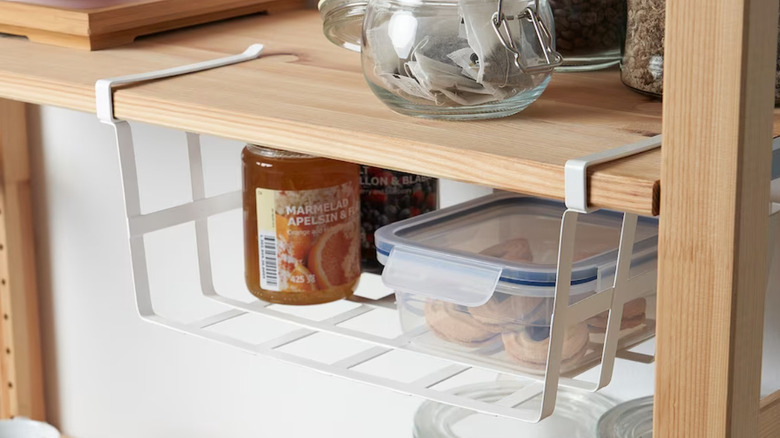 white clip-on basket on shelf