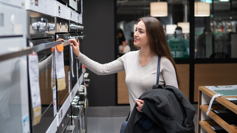 woman shopping for oven