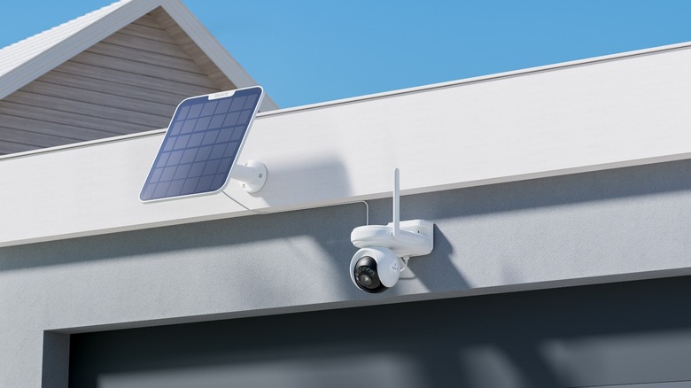 reolink altas pt ultra security camera on house