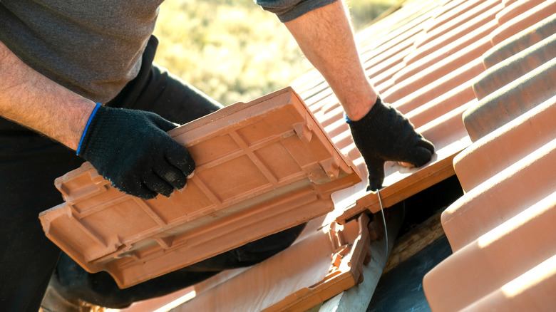 handyman repairing roof