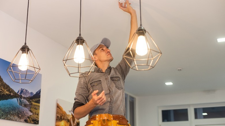 Handyman installing smoke detectors 