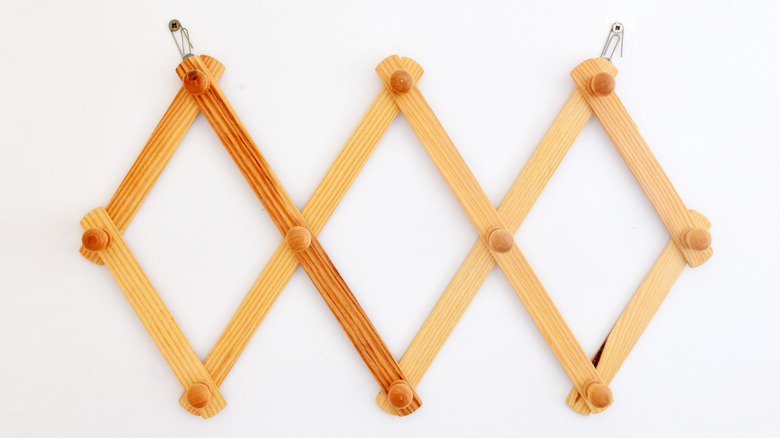 wall-mounted retractable wooden coat rack