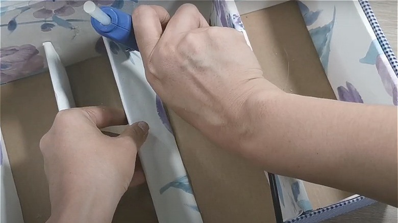 hot gluing dividers into shoebox