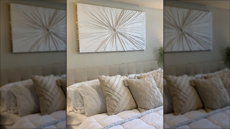 Bedroom with textured wall art using an old bed sheet