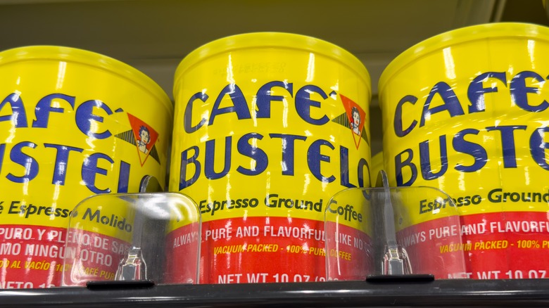 A shelf of coffee cans