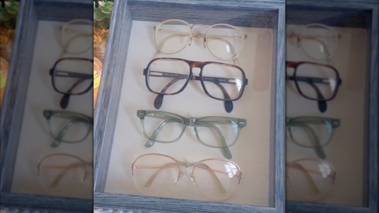 Sunglasses on display in a shadow box