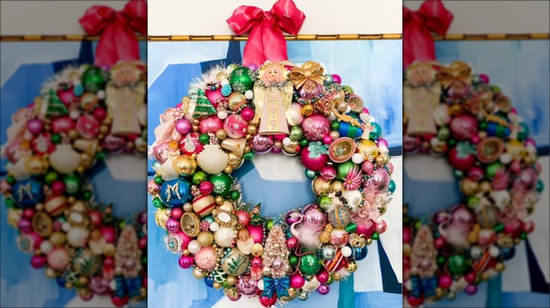 Wreath covered in colorful ornaments and jewelry pieces